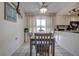 Dining area features gray table and chairs near kitchen at 3178 Sea Grape Dr, Hernando Beach, FL 34607