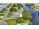 Aerial view of canal-front home with private dock and lush landscaping at 3178 Sea Grape Dr, Hernando Beach, FL 34607