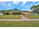 Image 1 of 77: 20 Woodcutter Ln, Palm Harbor