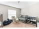 Bedroom featuring a crib, rocking chair, and changing table at 10432 Monarch St, Spring Hill, FL 34608