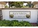 Key Vista Clubhouse entrance sign with seashell accents at 2529 Sandy Hill Ct, Holiday, FL 34691