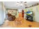 Living room with recliner, coffee table, and TV at 9140 & 9130 Peony St, New Port Richey, FL 34654