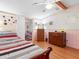 Bright bedroom with wood floors and a double bed at 9140 & 9130 Peony St, New Port Richey, FL 34654
