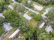 Aerial view of a single-Gathering home with surrounding neighborhood at 9140 & 9130 Peony St, New Port Richey, FL 34654