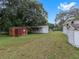 Backyard view of property with sheds at 9140 & 9130 Peony St, New Port Richey, FL 34654