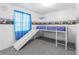 bedroom with built-in bunk bed and slide at 9140 & 9130 Peony St, New Port Richey, FL 34654