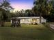 Cute yellow house with gazebo and fenced yard at 9140 & 9130 Peony St, New Port Richey, FL 34654