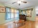 Living room with large windows and a view to kitchen at 9140 & 9130 Peony St, New Port Richey, FL 34654