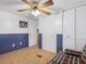 Bedroom with double closets and a plaid couch at 9140 & 9130 Peony St, New Port Richey, FL 34654