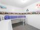 bedroom with bunk bed and slide at 9140 & 9130 Peony St, New Port Richey, FL 34654