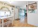 Kitchen and dining area with light wood floors at 9140 & 9130 Peony St, New Port Richey, FL 34654