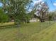 House with a spacious backyard and chain link fence at 9140 & 9130 Peony St, New Port Richey, FL 34654