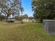 Large backyard with shed and mature trees at 9140 & 9130 Peony St, New Port Richey, FL 34654