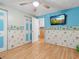 Bedroom with mounted TV and music decor at 9140 & 9130 Peony St, New Port Richey, FL 34654
