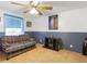 Bedroom with plaid couch and Star Wars poster at 9140 & 9130 Peony St, New Port Richey, FL 34654