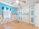 Bedroom with light walls, wood floors, and built-ins at 9140 & 9130 Peony St, New Port Richey, FL 34654