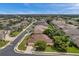 An aerial view showcasing a residential area with tree-lined streets and well-maintained homes, under a clear sky at 1641 Bayfield Ct, Trinity, FL 34655