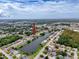 Aerial view of neighborhood with canal, showcasing the community's layout and proximity to water features and amenities at 7206 Ashwood Dr, Port Richey, FL 34668