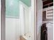 Full shower with curtain is located next to utility hook-ups for washer and dryer at 7206 Ashwood Dr, Port Richey, FL 34668