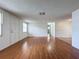 Living room with hardwood floors and neutral walls at 7206 Ashwood Dr, Port Richey, FL 34668