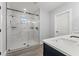 Bathroom with large walk-in shower and marble tile at 5406 Boxtree Ct, Dade City, FL 33523
