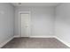 Simple bedroom with grey walls and carpet at 5406 Boxtree Ct, Dade City, FL 33523