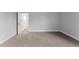 Another bedroom with grey walls and carpet at 5406 Boxtree Ct, Dade City, FL 33523