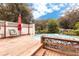 Spacious wooden deck with steps leading to the pool and backyard views at 24514 Audubon Dr, Brooksville, FL 34601