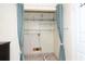 Small laundry room with shelving and hookups at 24514 Audubon Dr, Brooksville, FL 34601