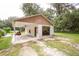 Detached garage with covered carport at 24514 Audubon Dr, Brooksville, FL 34601