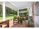 Front porch with seating and view of yard at 24514 Audubon Dr, Brooksville, FL 34601