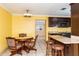 Bright dining area with a round table and four chairs at 24514 Audubon Dr, Brooksville, FL 34601