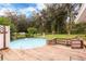 Large above ground pool with spacious wooden deck and backyard at 24514 Audubon Dr, Brooksville, FL 34601
