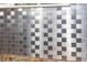 Modern kitchen backsplash with metallic tiles at 24514 Audubon Dr, Brooksville, FL 34601