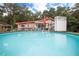 Inviting above-ground pool with wooden deck and surrounding backyard at 24514 Audubon Dr, Brooksville, FL 34601