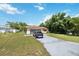 Single-story home with a two-car garage and grassy yard at 10463 Claymore St, Spring Hill, FL 34608