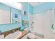 Clean bathroom, featuring a bathtub, vanity, and light blue walls at 11143 Merganser Way, New Port Richey, FL 34654