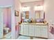 Bathroom showcasing a double vanity, toilet, and neutral color palette at 11143 Merganser Way, New Port Richey, FL 34654