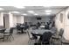Community room with tables and chairs for residents at 11143 Merganser Way, New Port Richey, FL 34654
