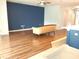 Open living space features laminate flooring and view of the kitchen at 11143 Merganser Way, New Port Richey, FL 34654