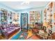 Living room features a wine fridge, leather furniture, and lots of shelving at 11143 Merganser Way, New Port Richey, FL 34654