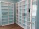 Home office showcasing custom-built shelving, offering ample storage and display space at 11143 Merganser Way, New Port Richey, FL 34654
