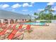 Inviting community pool with lounge chairs, perfect for relaxing and enjoying sunny days at 11143 Merganser Way, New Port Richey, FL 34654
