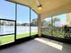 A screened patio with a ceiling fan offering an outdoor living space at 13626 Bryndlewood Ct, Hudson, FL 34669
