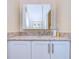 Bathroom vanity features granite countertops, modern fixtures, and a framed mirror at 3605 Kings Rd # 102, Palm Harbor, FL 34685