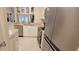 Bright kitchen featuring white cabinets, stainless steel appliances, and granite countertops at 3605 Kings Rd # 102, Palm Harbor, FL 34685