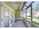 Screened porch with ceiling fan offers outdoor living space at 3605 Kings Rd # 102, Palm Harbor, FL 34685