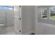 View of a bedroom from the bathroom with tiled shower and bathroom view at 3898 Southern Valley Loop, Brooksville, FL 34601