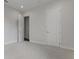 A tidy bedroom with carpet flooring featuring a closet and open entry at 3898 Southern Valley Loop, Brooksville, FL 34601