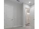 Clean bedroom featuring carpet flooring, two doors, and a bright light at 3898 Southern Valley Loop, Brooksville, FL 34601